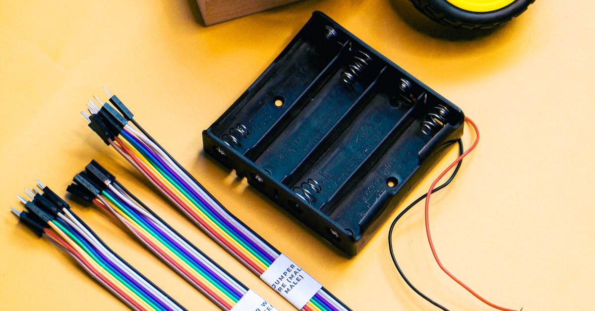 Yellow Box Lab Component Yellow Robotics Kit Components on Yellow Background · Free Stock Photo