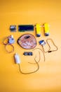 Flat Lay of Robotics Kit Components on Yellow Background