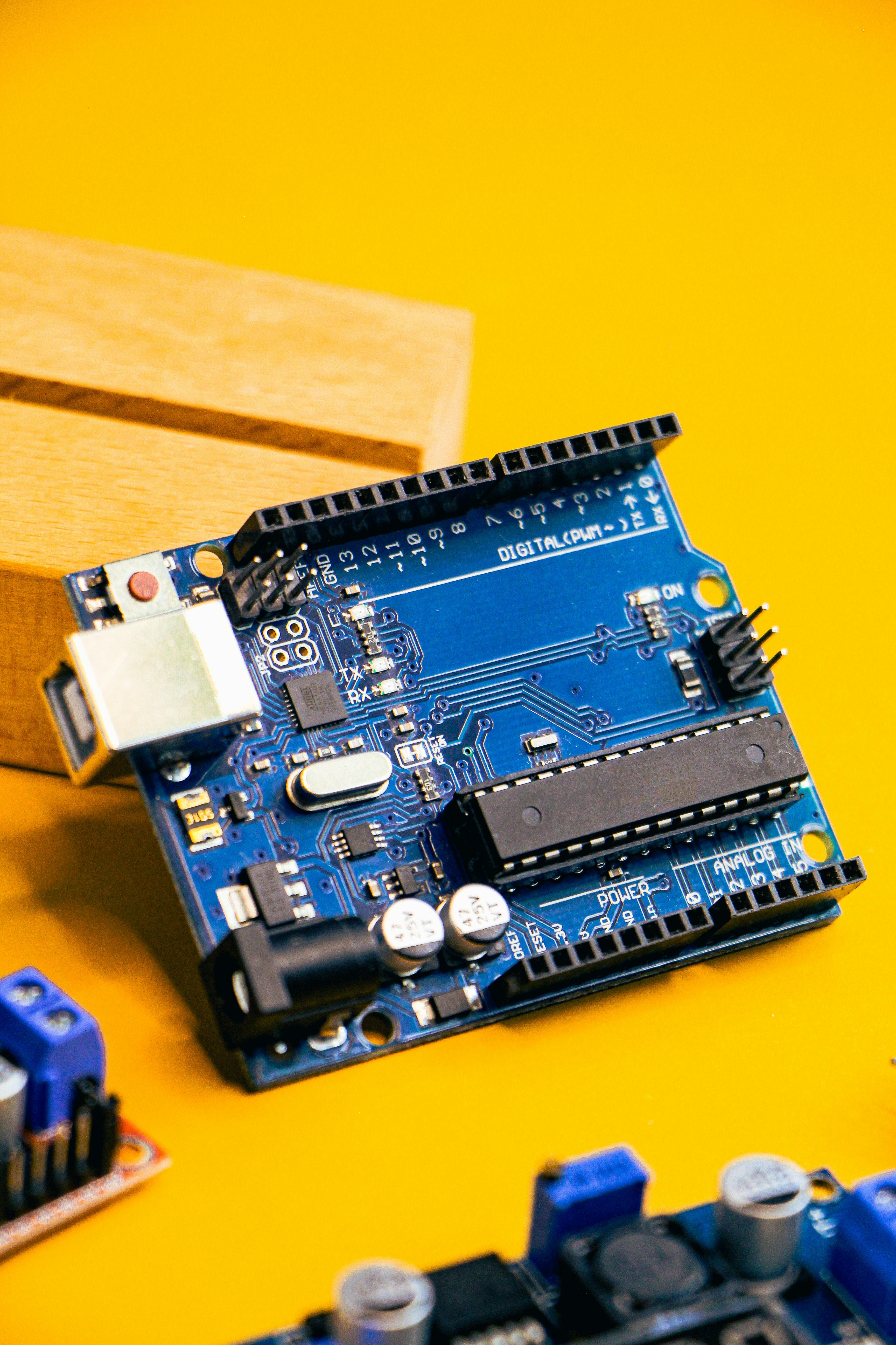 Arduino Microcontroller on Yellow Background