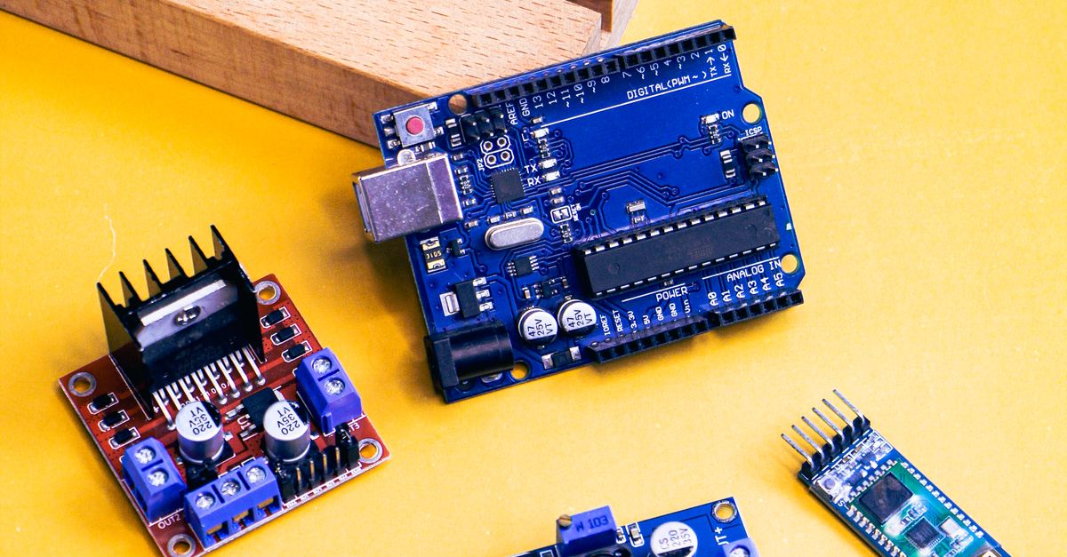 Components Yellow Background Electronic Components on Yellow Background · Free Stock Photo