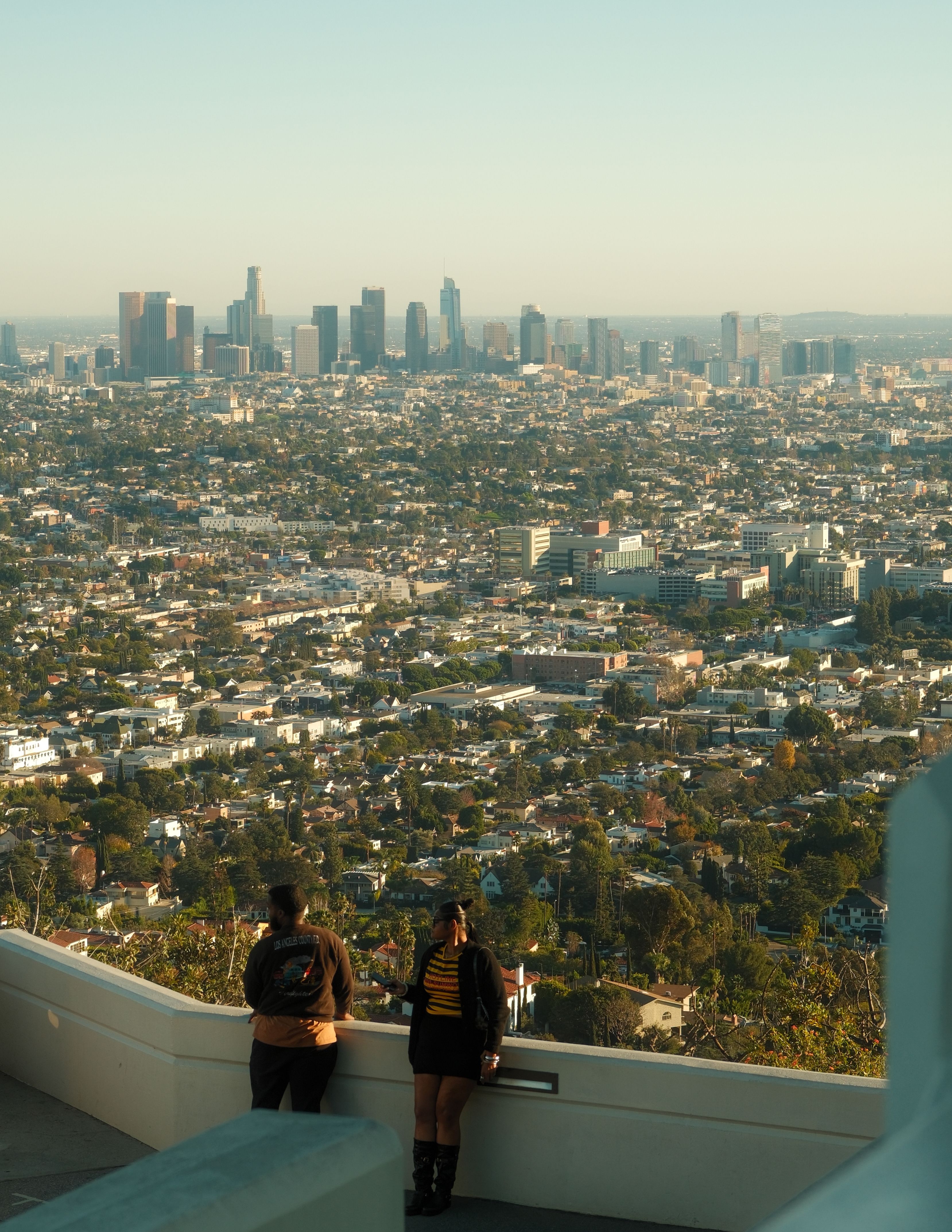 Panoramic view of Los Angeles California skyline from Griffith Observatory with city sprawl extending to the ocean
