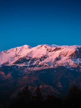 Stunning view of the snow-capped Taurus Mountains in Alanya, Turkey at sunset.