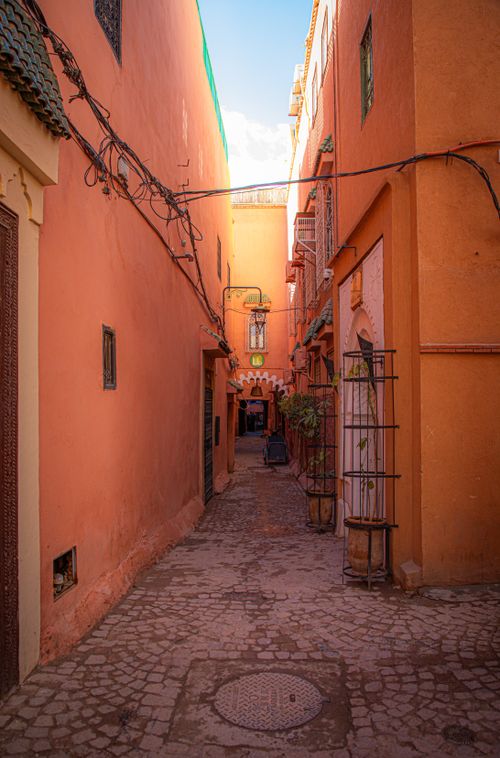 Free Discover the vibrant alleys of Marrakesh with this stunning street view. Stock Photo