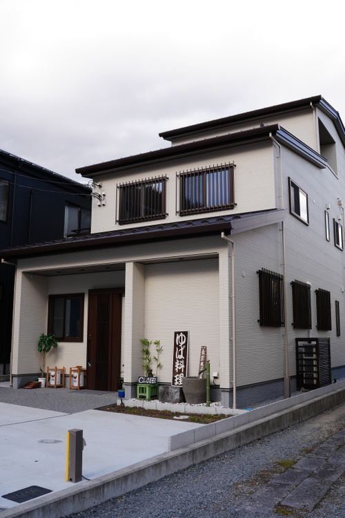 Free Exterior view of a modern yet traditional home in Nikko, Tochigi, Japan, showcasing architectural style. Stock Photo
