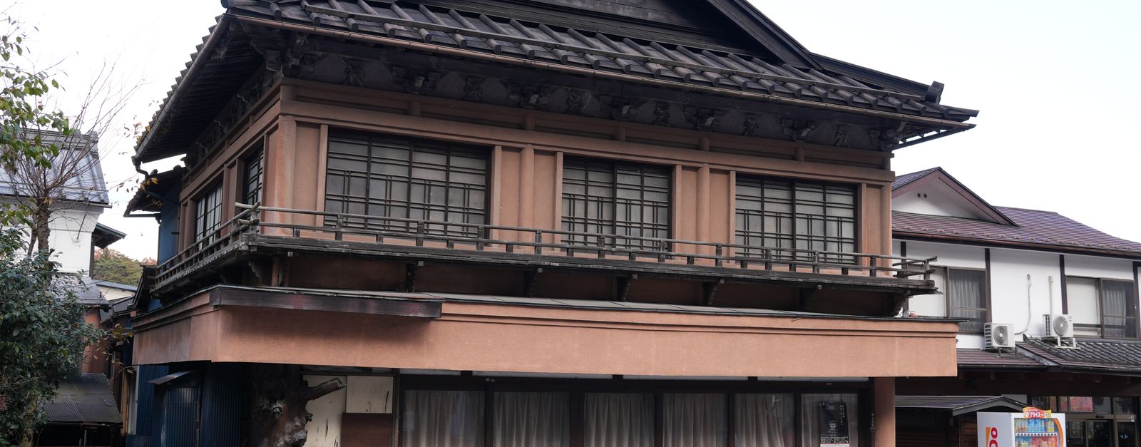 Classic Japanese architecture showcased in a wooden building on a quiet street in Nikko, Tochigi.