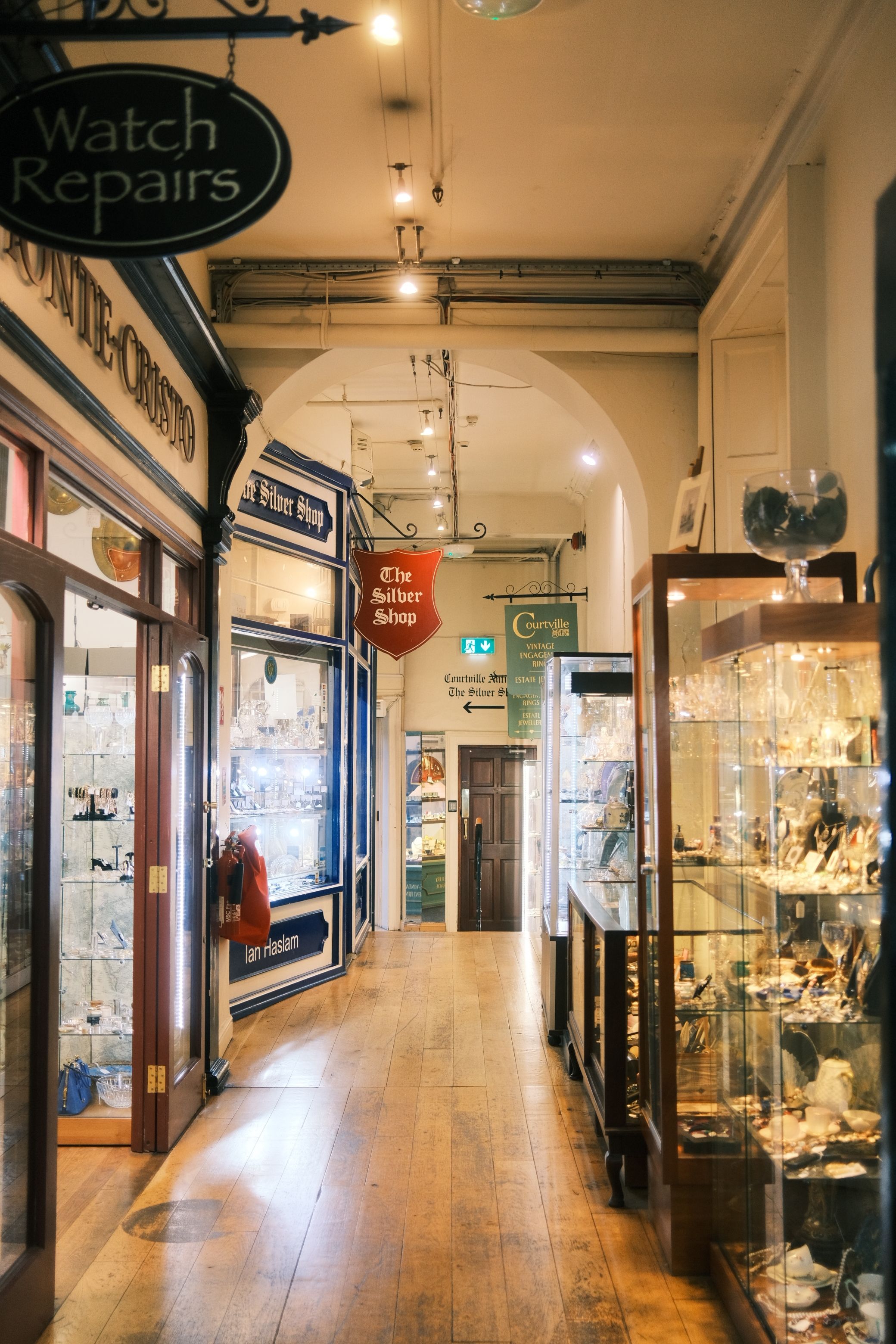 Explore a vintage shopping arcade filled with antique displays and classic signage.