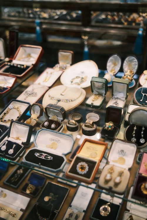 Free A variety of vintage jewelry pieces showcased in a luxurious display case, offering elegant charm. Stock Photo