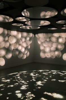 Artistic abstract lighting installations creating a moody visual experience.