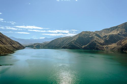 Free Captivating view of the Andes mountains and a tranquil lake under a clear blue sky in Tacna, Peru. Stock Photo