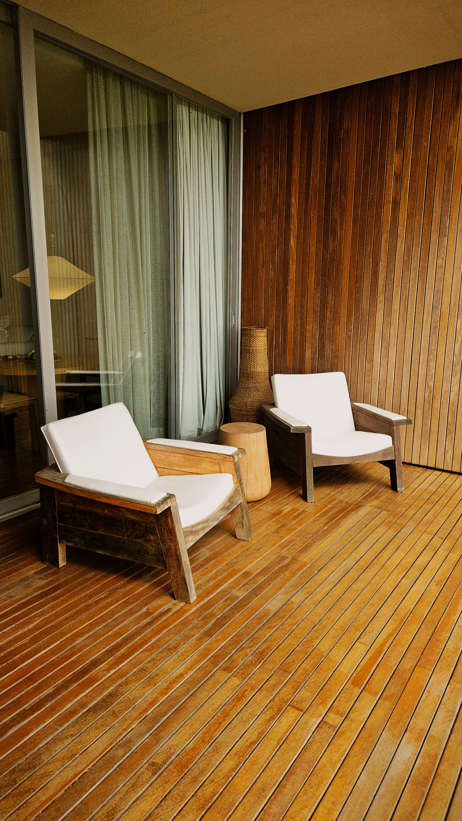 Modern wooden deck with lounge chairs showing a relaxed low-maintenance outdoor living space