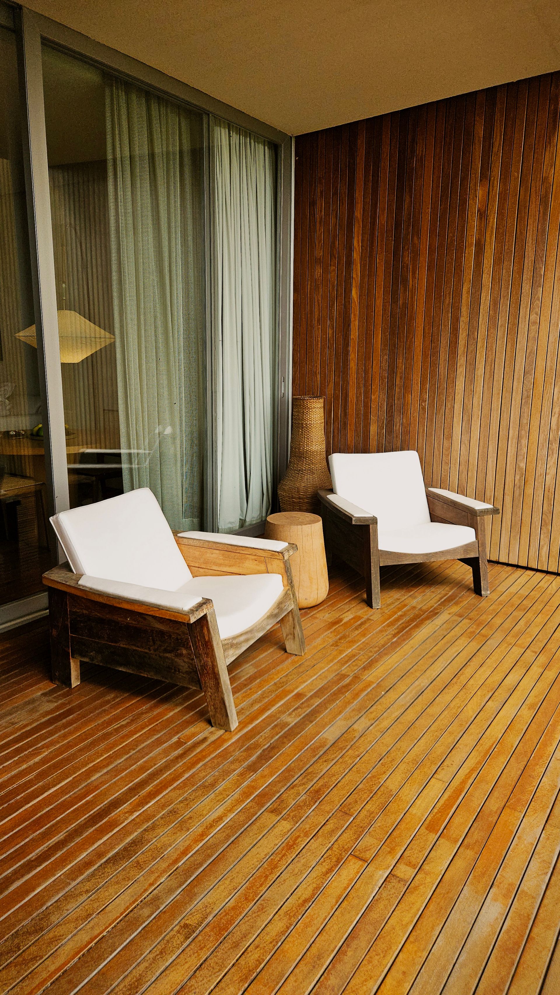Clean wooden deck with lounge chairs and visible deck boards