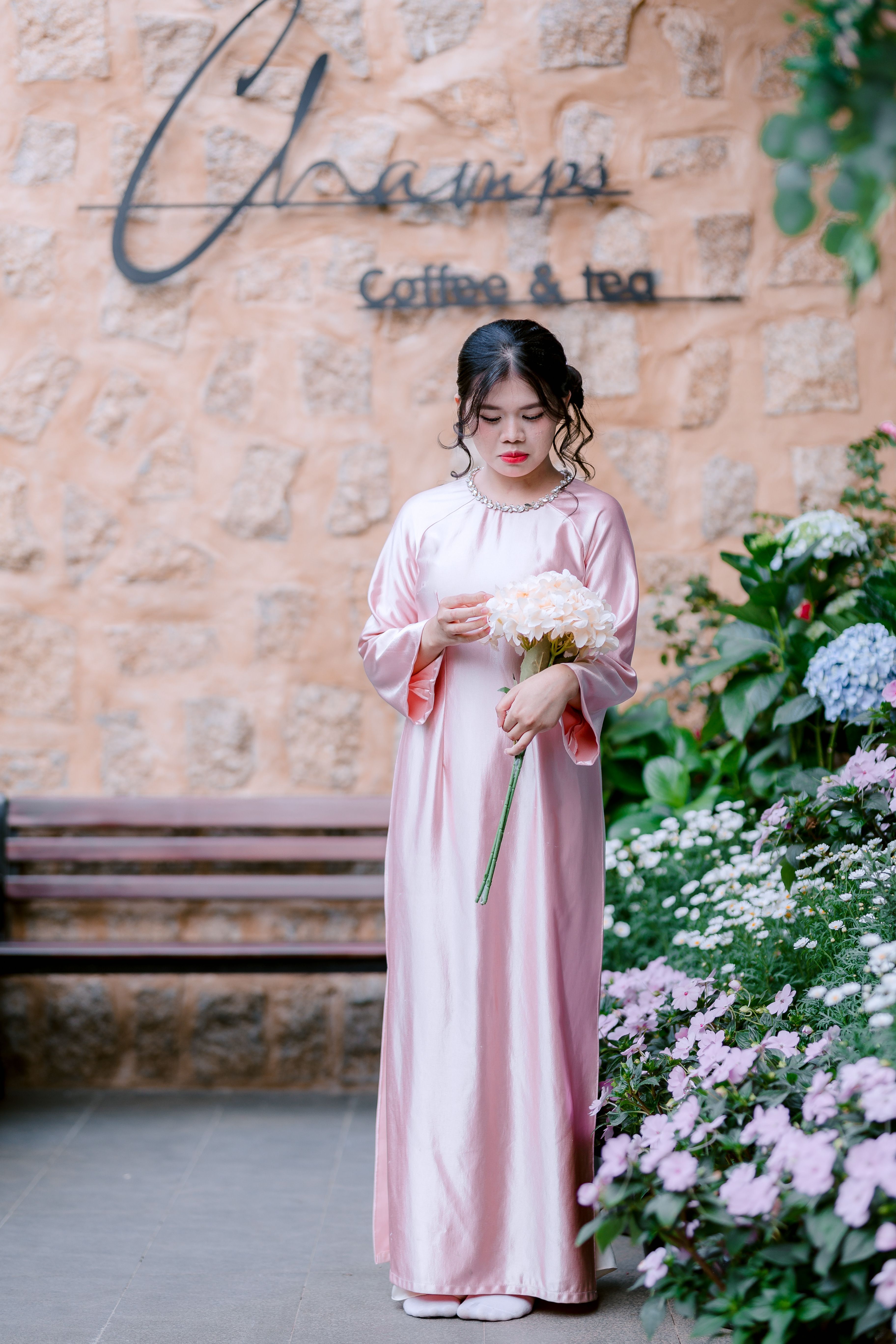 Woman in Pink Dress Holding Flowers Outdoor · Free Stock Photo