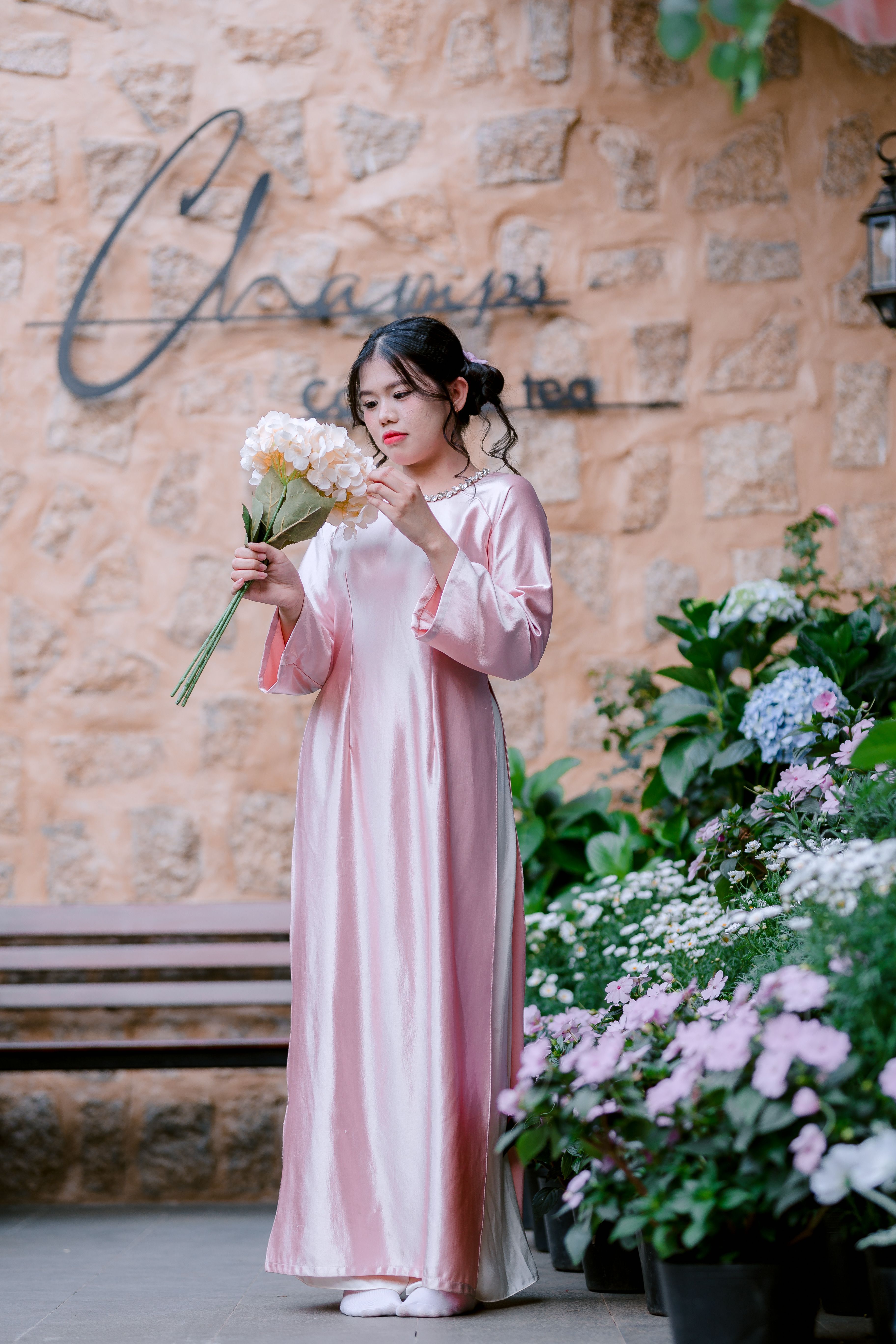 Elegant Woman in Pink Dress Holding Bouquet · Free Stock Photo