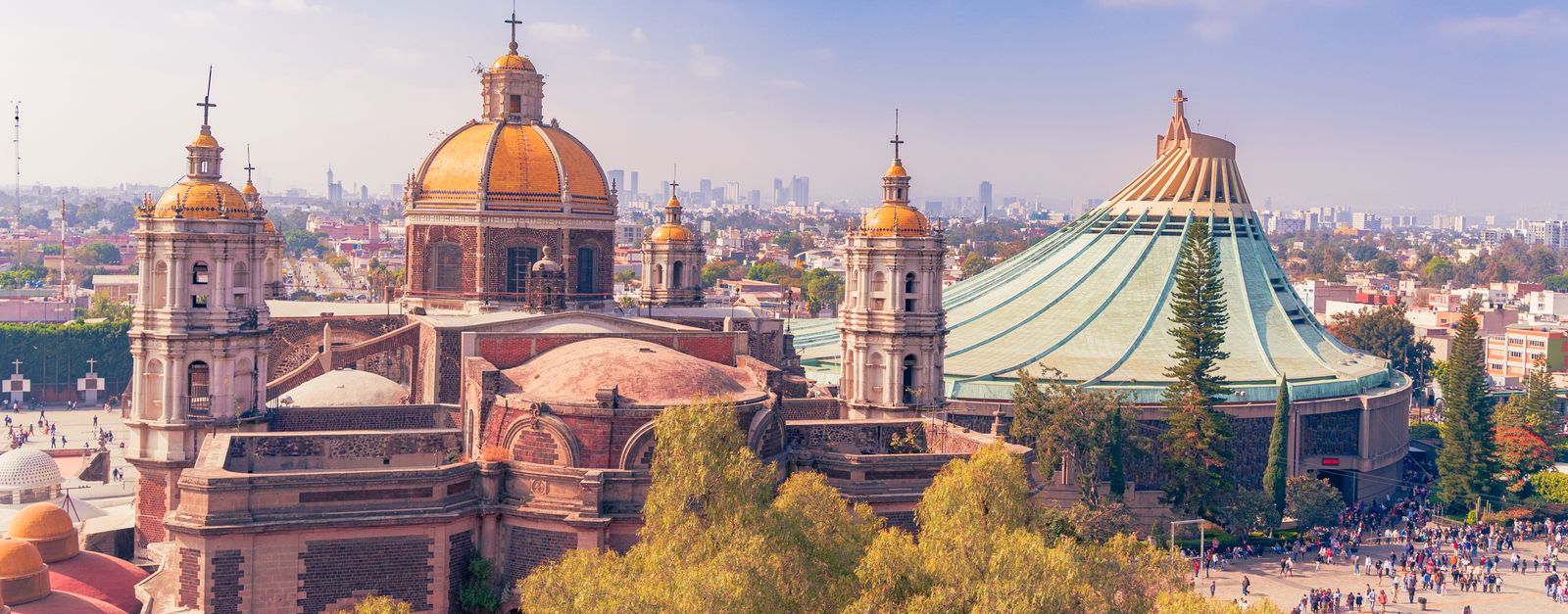 A stunning aerial view of the Basílica de Guadalupe in Mexico City, showcasing iconic architecture and vibrant city life.
