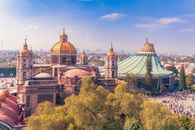A stunning aerial view of the Basílica de Guadalupe in Mexico City, showcasing iconic architecture and vibrant city life.