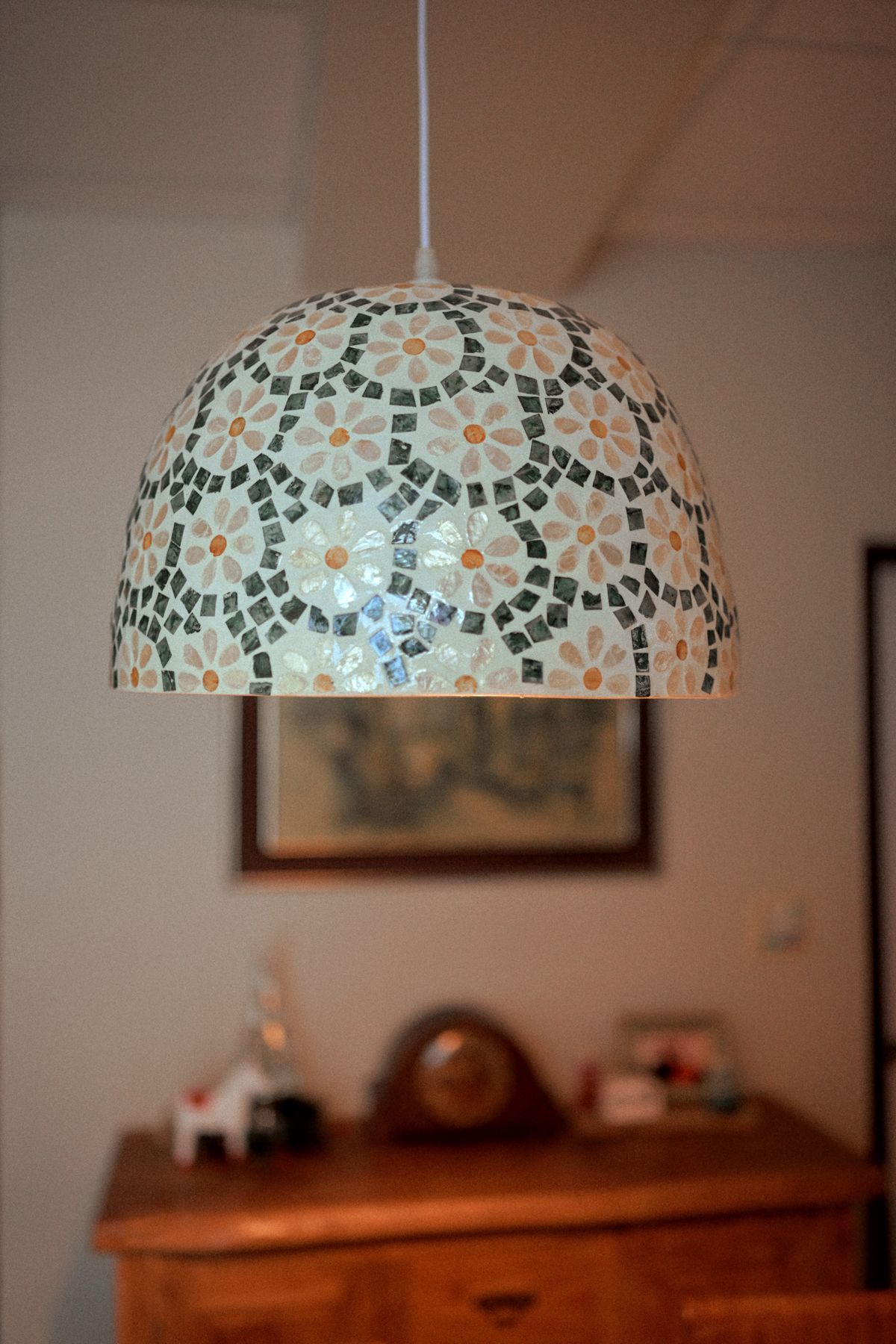 Mosaic glass pendant lamp hanging in a room