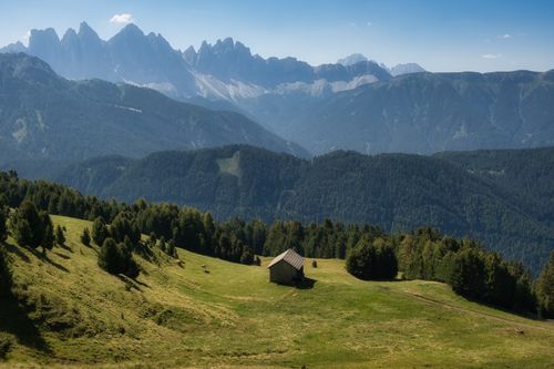 Free Beautiful panoramic view of the Dolomites mountains and green meadows in Trentino-Alto Adige, Italy. Stock Photo