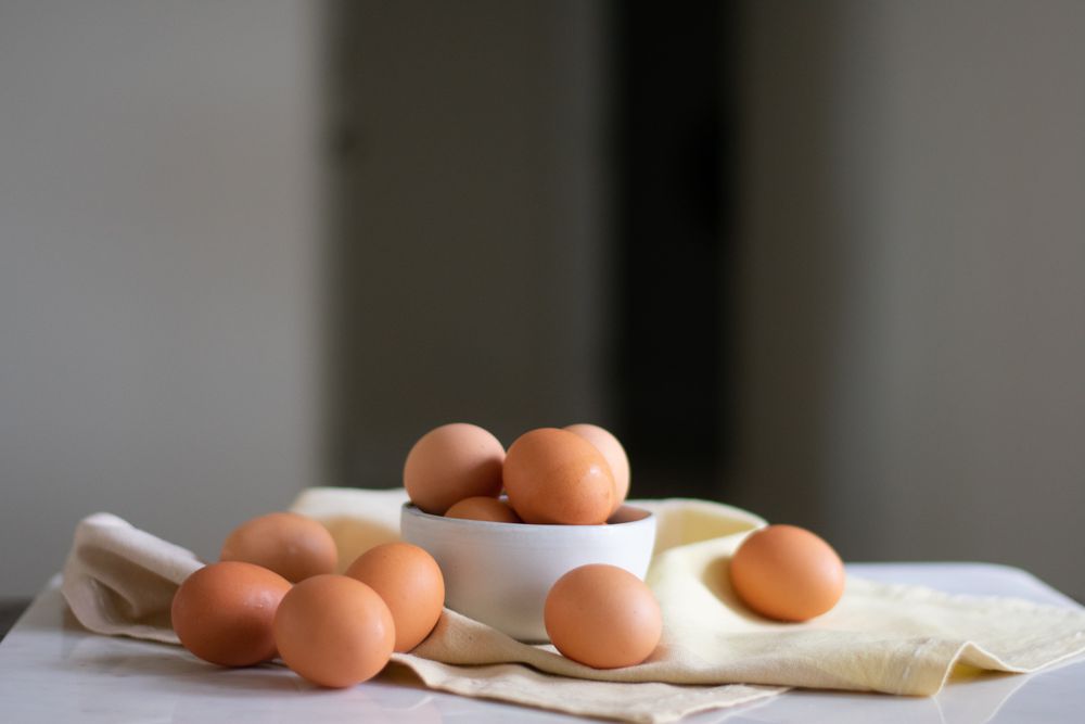 Brown eggs in a ceramic bowl