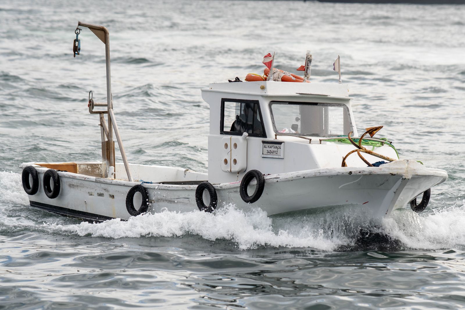 Small practical working boat on the water