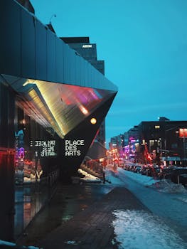 Place des Arts in Montreal glowing with urban lights on a winter evening.
