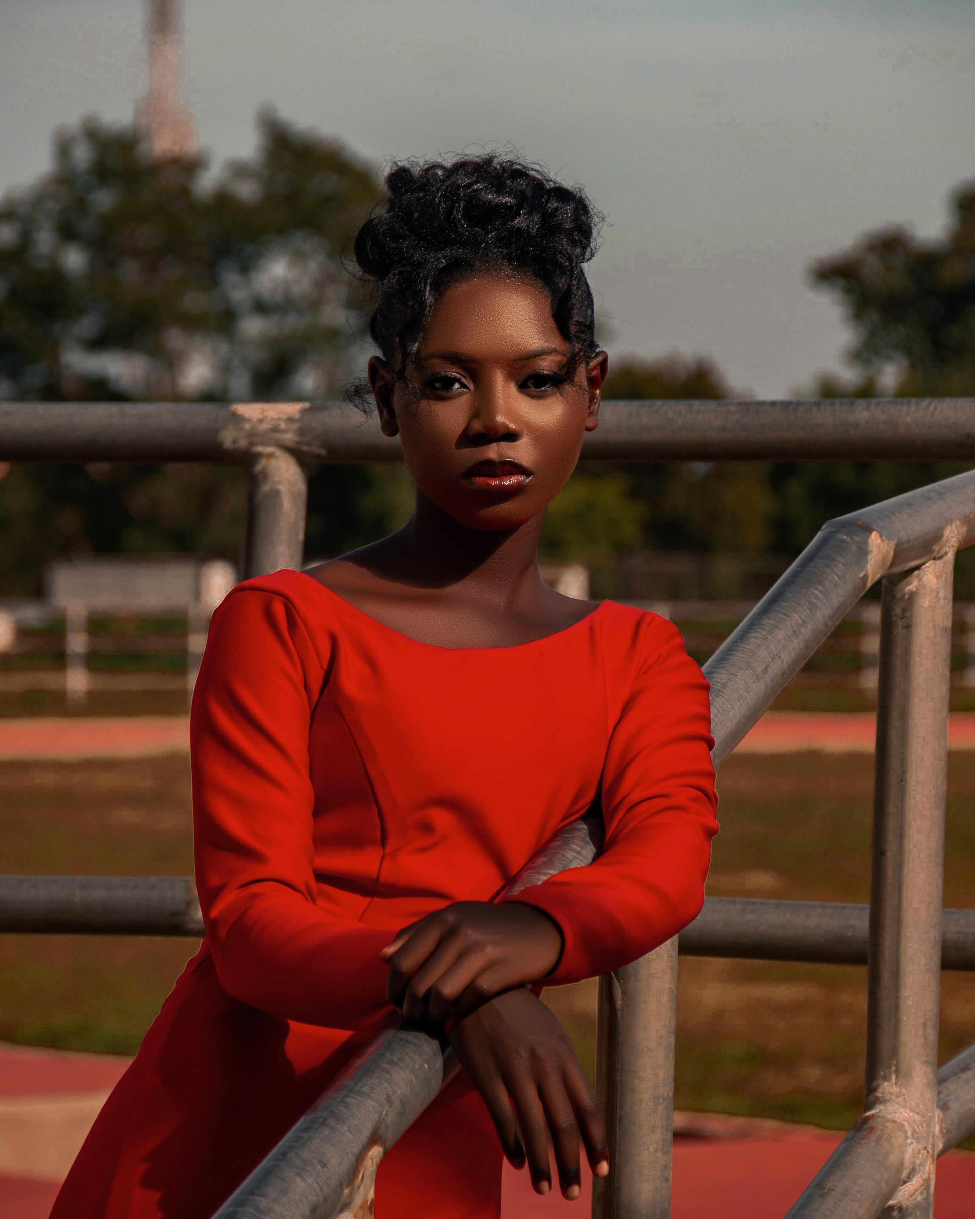 Elegant Woman in Red Dress Outdoors · Free Stock Photo
