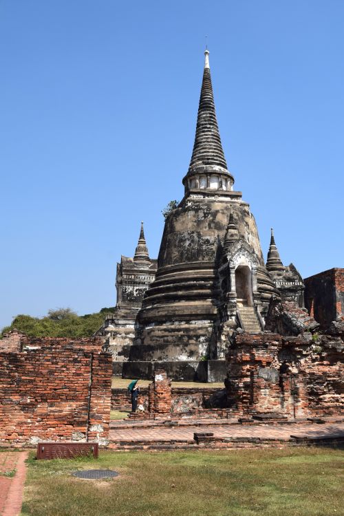 Free Explore the towering ruins of Wat Phra Si Sanphet in Ayutthaya, Thailand's historical park under a clear blue sky. Stock Photo