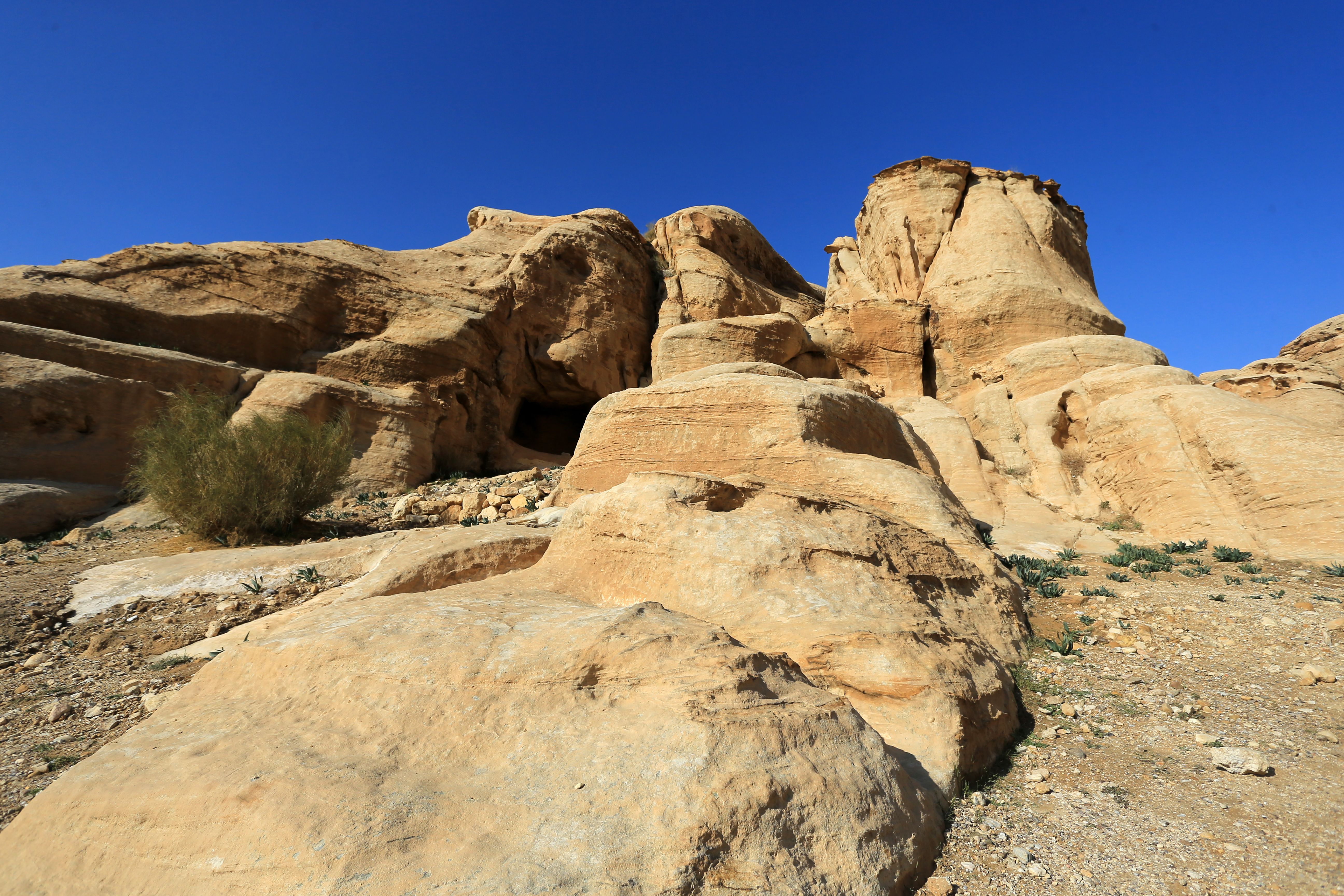 Dramatic Desert Sandstone Formations Under Blue Skies · Free Stock Photo