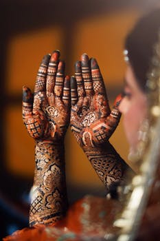 Detailed bride hands with intricate mehendi design, perfect for wedding themes.