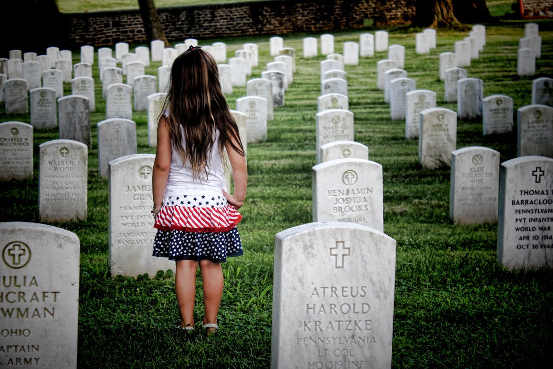 Girl Surrounded by Gravestones