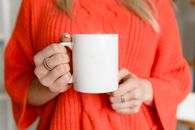 Photo of Person's Hand Holding White Mug