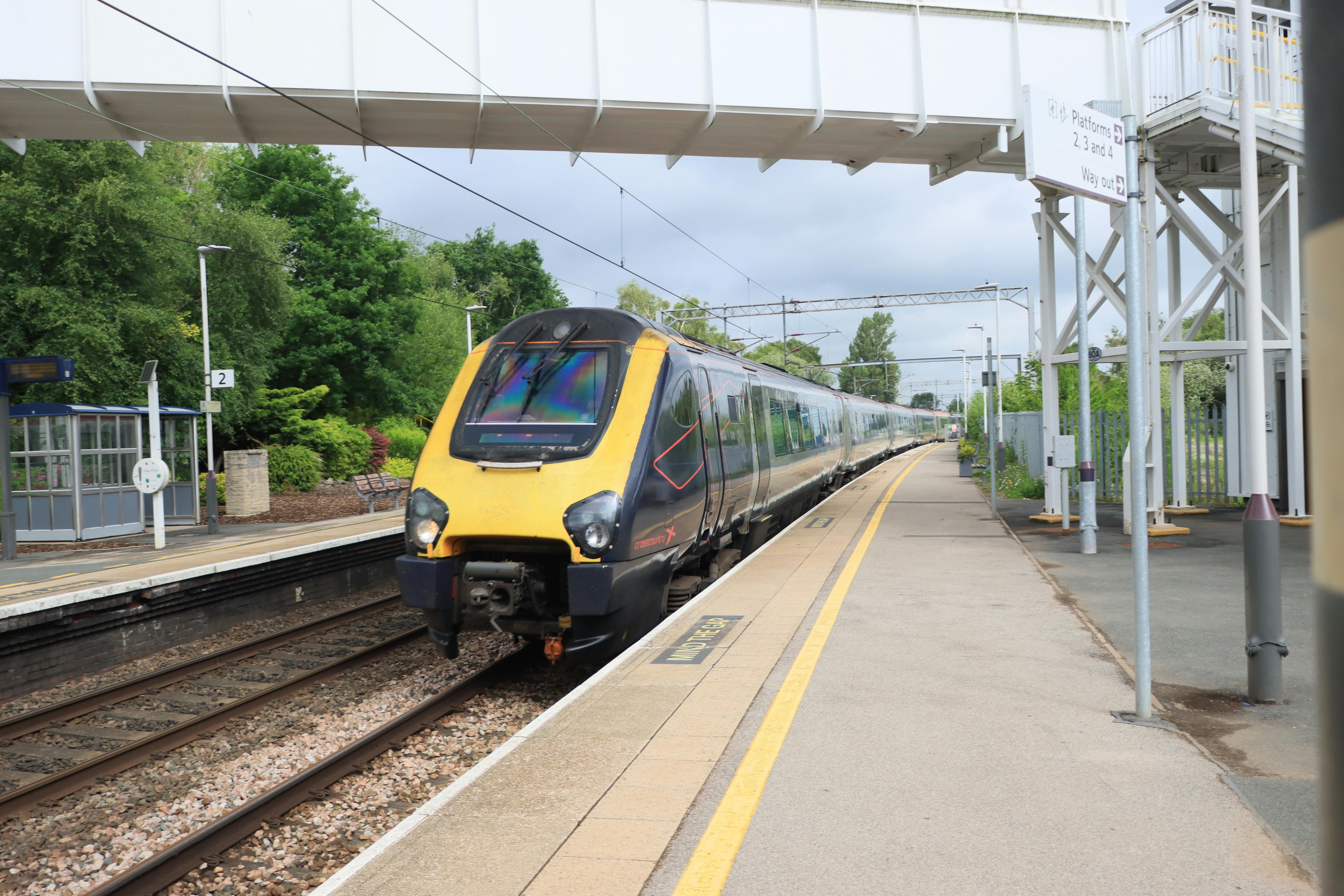 A high-speed train approaching the platform at Kidsgrove railway station in England.