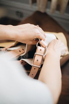 Elegant artisan craftsmanship showcasing a focus on handcrafted leather bag details.