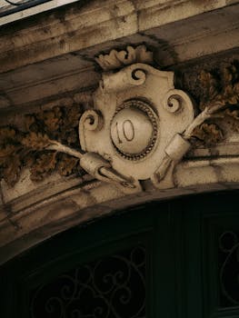 Close-up of ornate architectural detail showing the number 10 in Nantes, France.