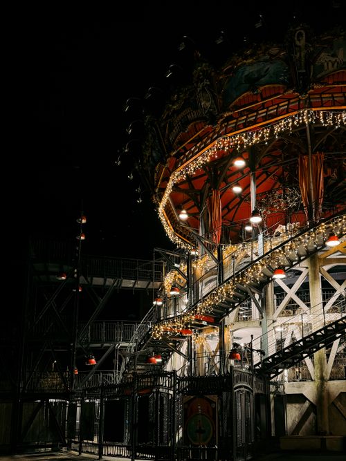 Free A beautifully illuminated carousel in Nantes captured at night, showcasing intricate details and glowing lights. Stock Photo