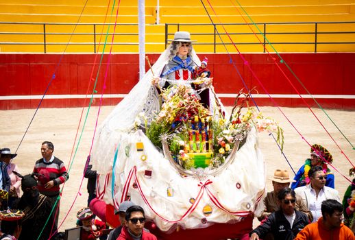 Colorful traditional parade featuring Virgin Mary float in Cayma, Arequipa, Perú.