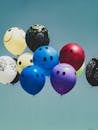 Colorful Smiley Face Balloons Floating in Sky