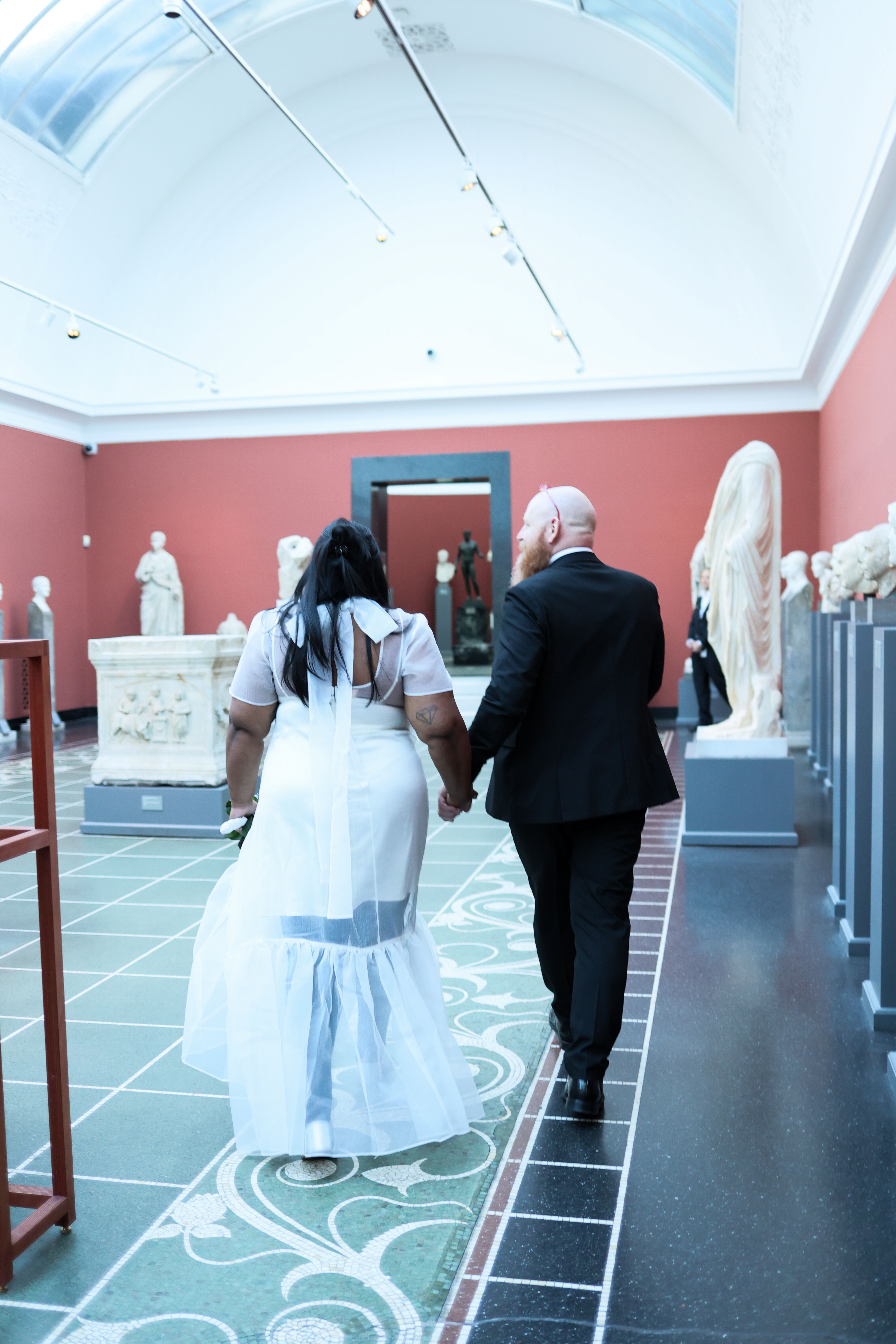Couple walking through a museum gallery together