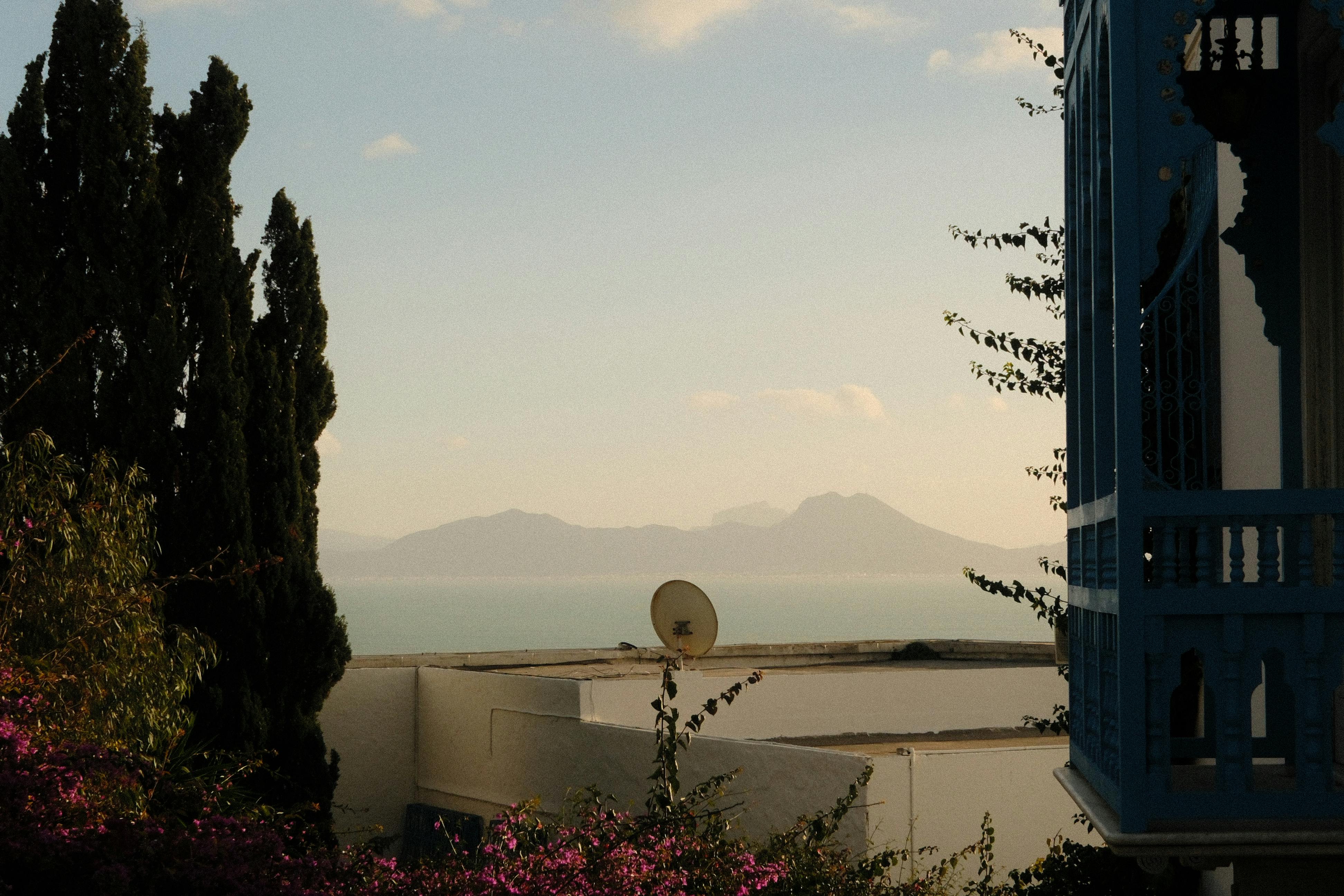 Warm summer view of Carthage with Mediterranean Sea and mountains in the background. - Sidi Bou Said