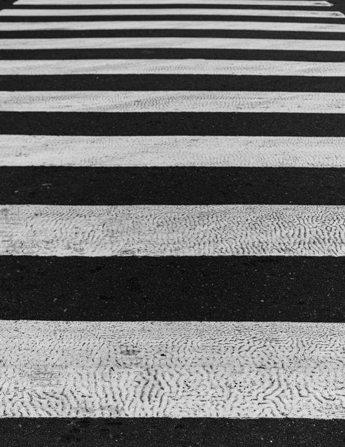 Free Artistic black and white crosswalk with high contrast and tactile textures. Stock Photo