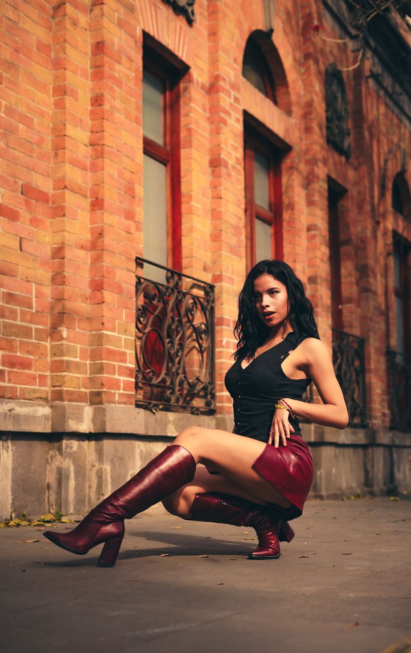 Stylish Woman in Black Outfit Posing Outdoors · Free Stock Photo