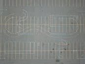 Aerial View of an Empty Parking Lot with Road Markings