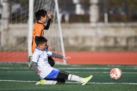 Youth soccer players in action during a game, showcasing teamwork and sportsmanship.