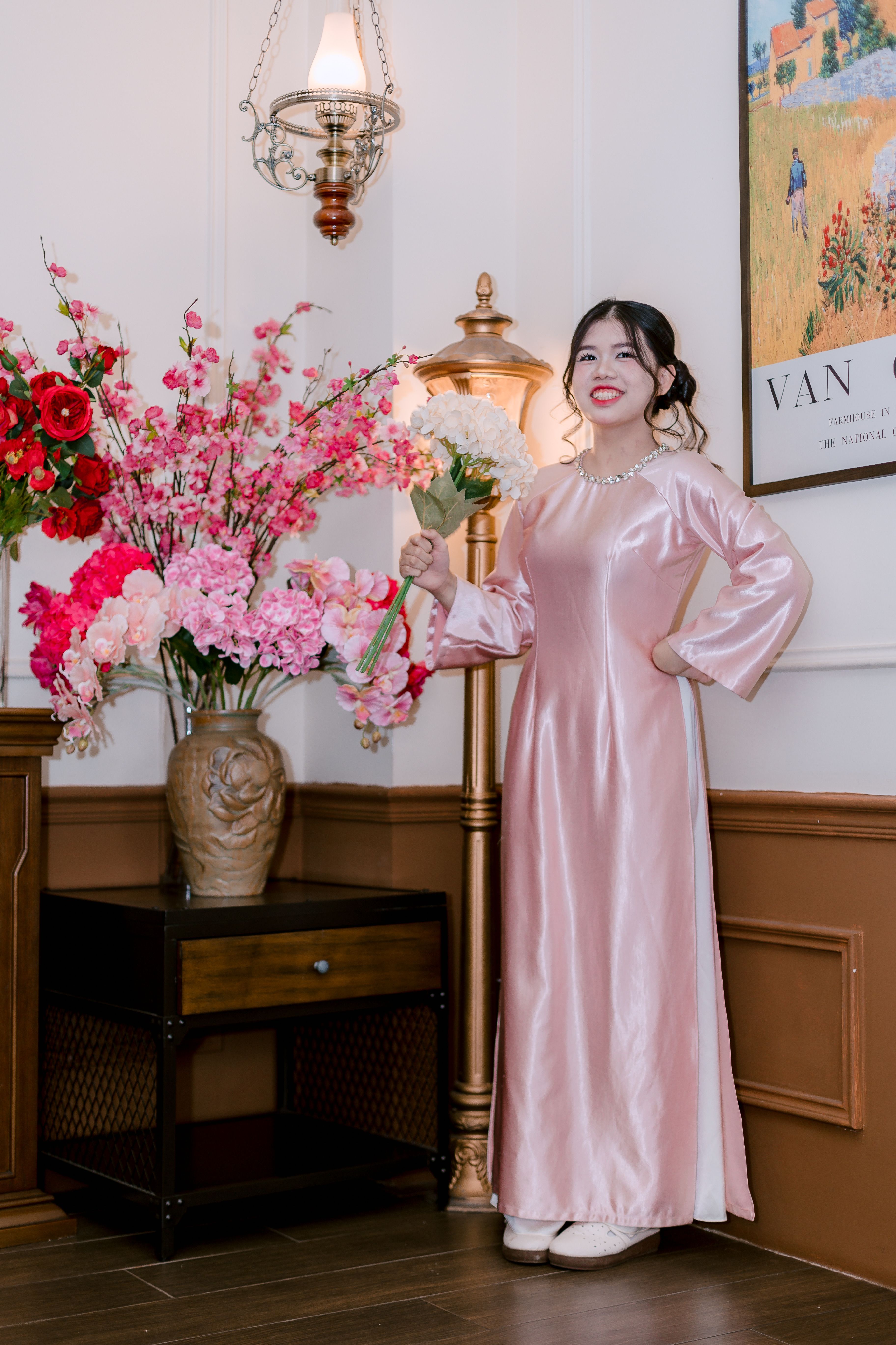 Elegant Woman in Pink Dress with Flowers Indoors · Free Stock Photo