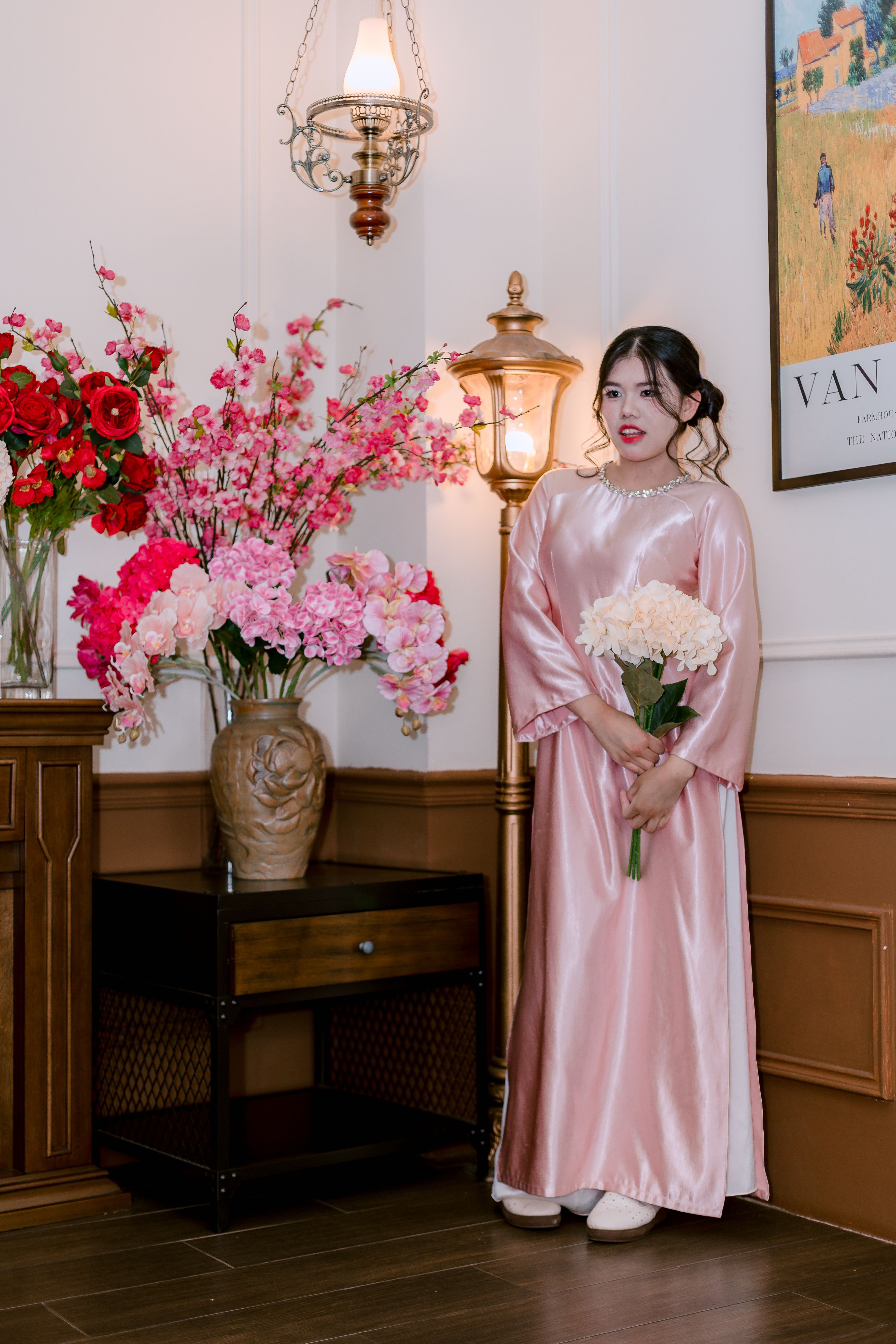 Woman in Pink Traditional Dress Holding Flowers · Free Stock Photo
