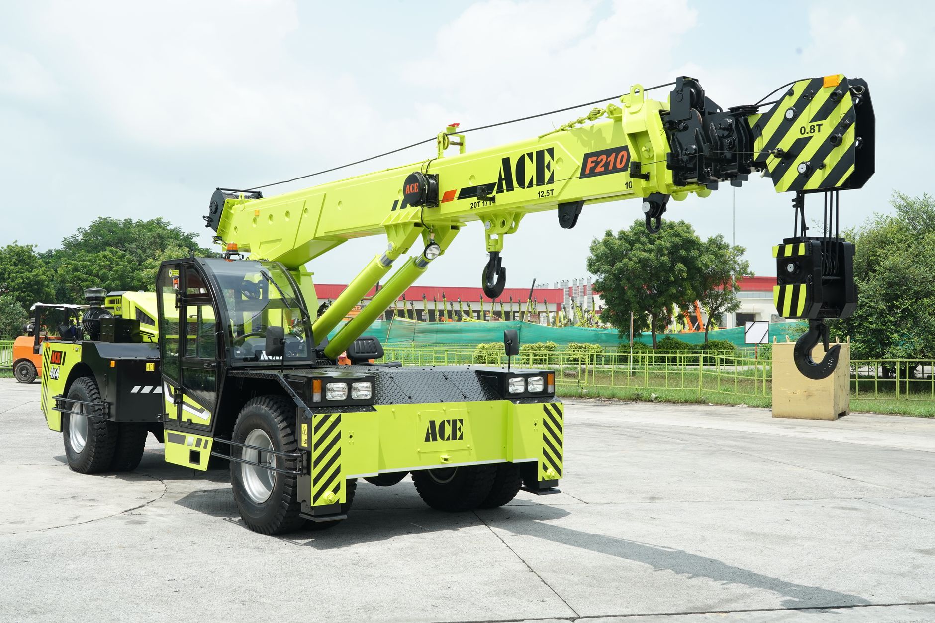 ACE F210 crane displayed outdoors in a construction setting, showcasing engineering prowess.