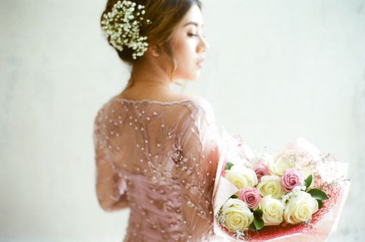 Woman With A Bouquet Of Flowers