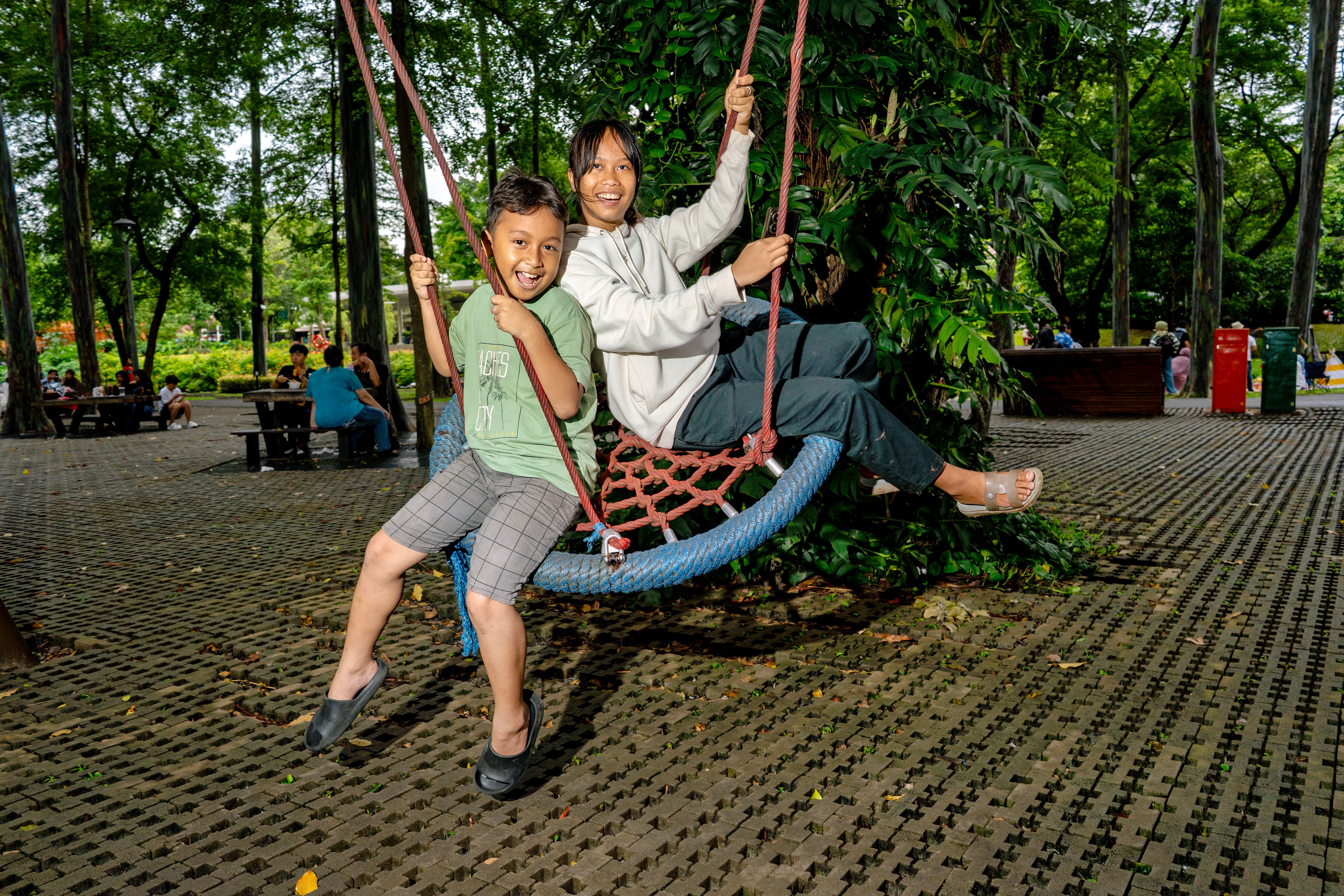 Joyful outdoor swing ride in Jakarta park · Free Stock Photo