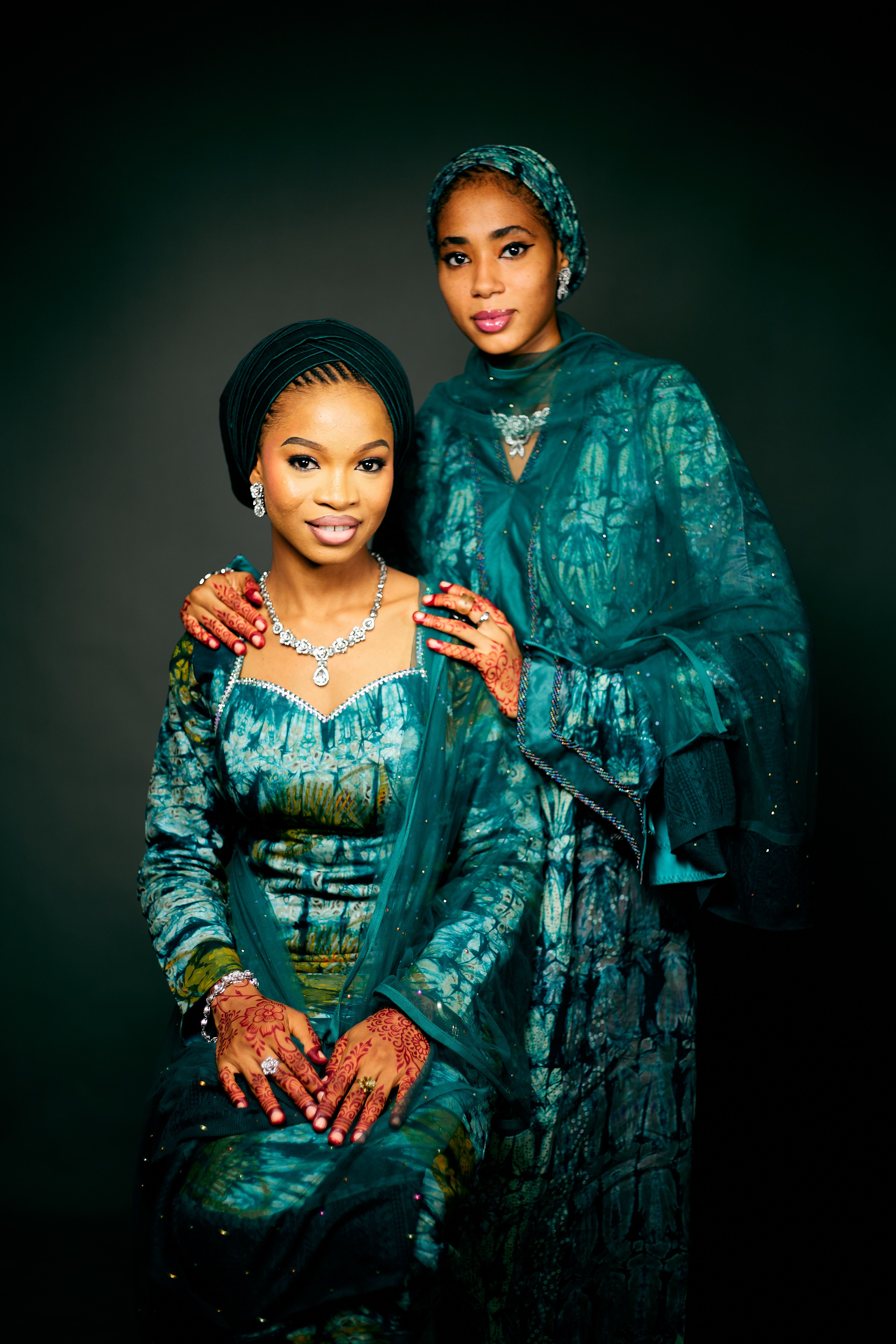 Elegant Portrait of Two Women in Traditional Attire · Free Stock Photo