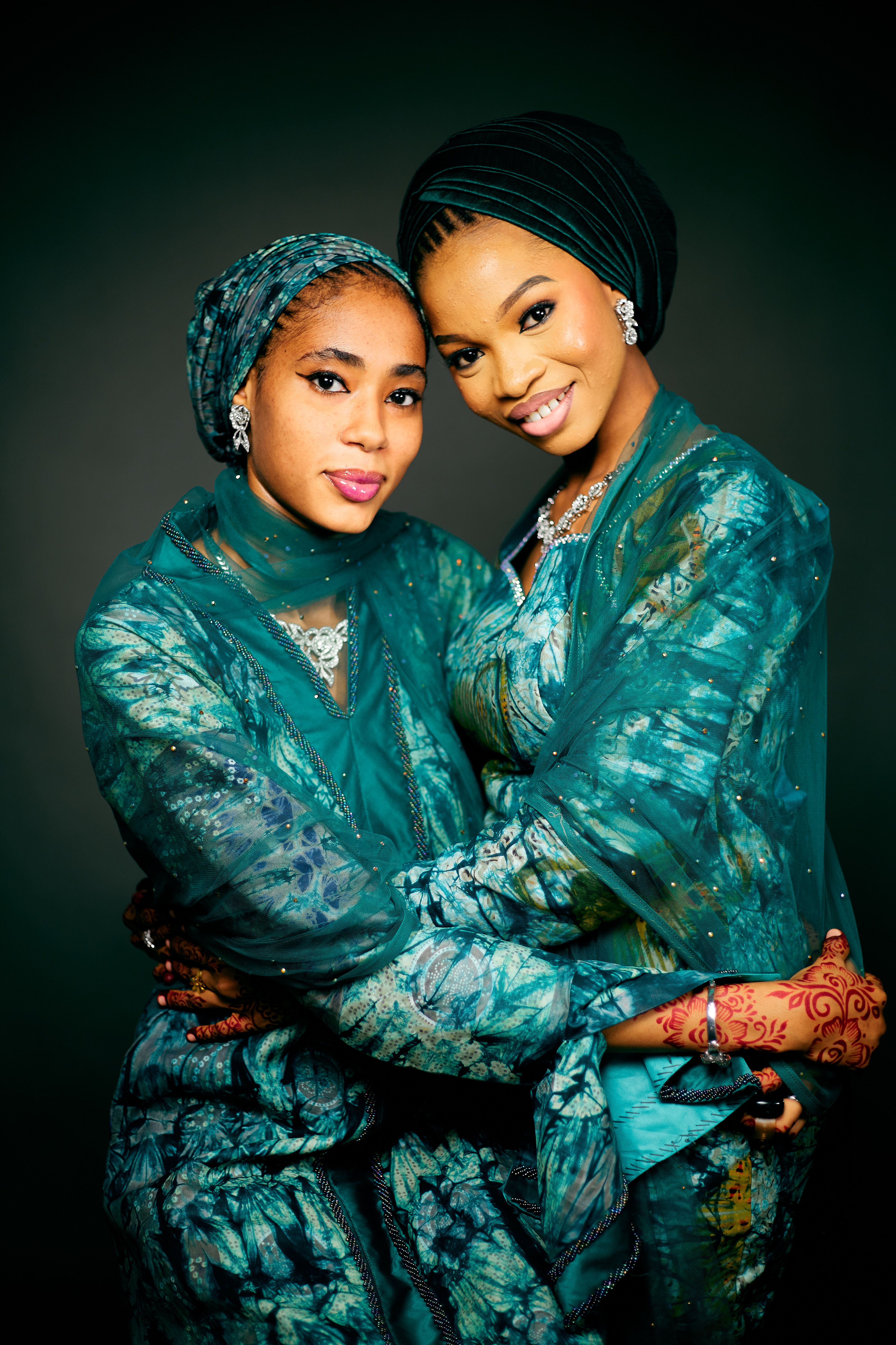 Elegant Portrait of Two Women in Traditional Attire · Free Stock Photo