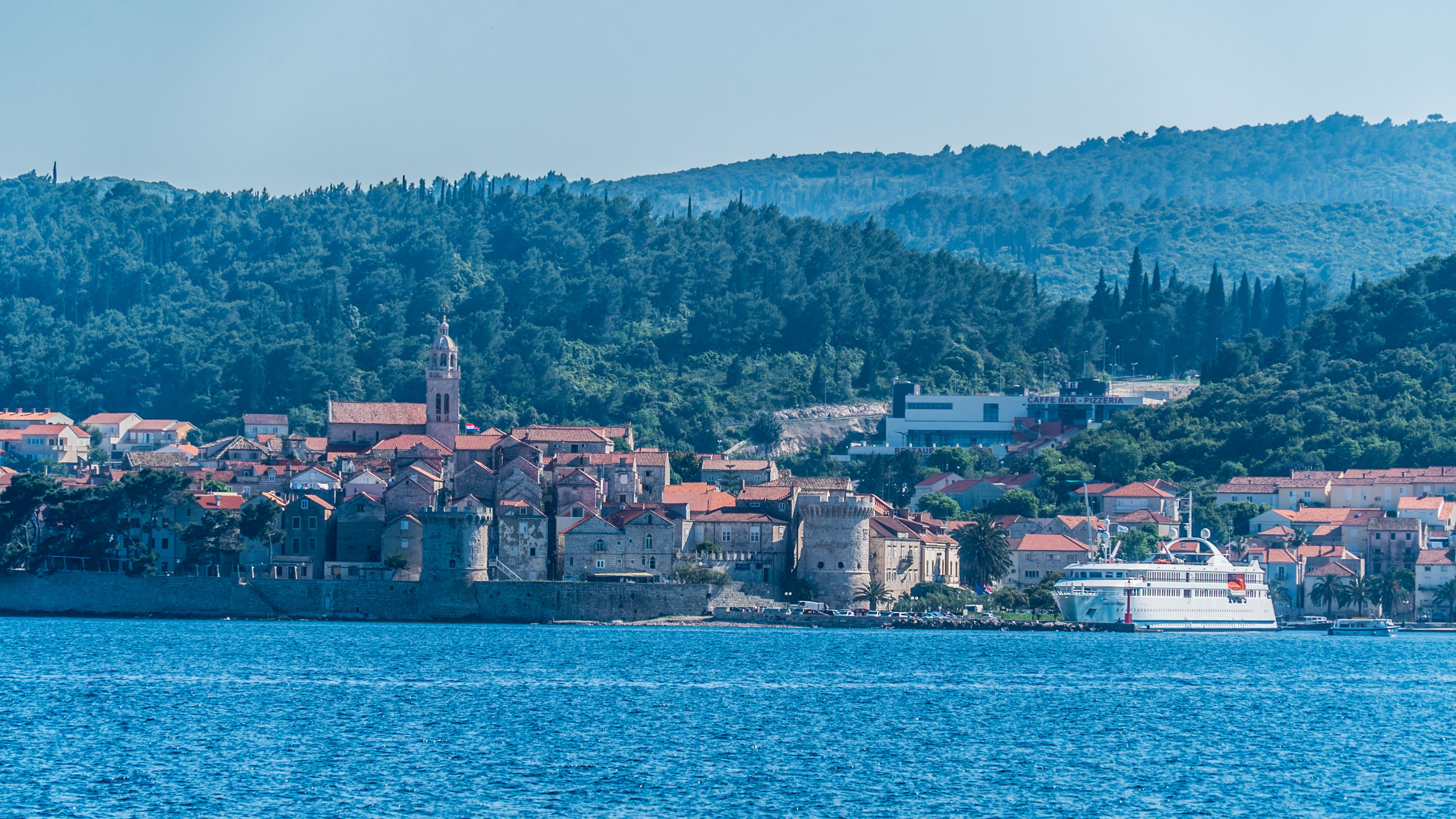Captivating coastal view of Korčula Island, Croatia, showcasing historic architecture and scenic seascape.